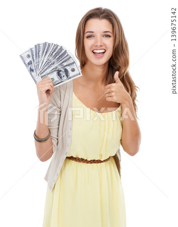Portrait, studio and happy woman with thumbs up for money, financial prize or approve of lotto competition reward. Dollars, cash and winner with emoji like sign for loan success on white background Portrait, studio and happy woman with thumbs up for money, financial prize or approve of lotto competition reward. Dollars, cash and winner with emoji like sign for loan success on white background 139675142