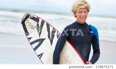 Surfer, boy and happy on beach with surfboard, vacation and adventure for fitness and travel. Ocean, waves for surfing and teen on seaside holiday in Hawaii, nature and tourism with extreme sports Surfer, boy and happy on beach with surfboard, vacation and adventure for fitness and travel. Ocean, waves for surfing and teen on seaside holiday in Hawaii, nature and tourism with extreme sports 139675271