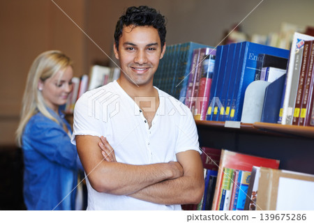 College, arms crossed or portrait of happy man in a library for knowledge or school for future. Scholarship, education or male student with smile, joy or pride for studying or learning in campus 139675286