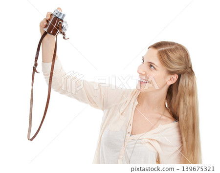 Camera, happy woman and selfie in studio for fun hobby, memory or photoshoot on white background. Lens, face or female model smile for self portrait with vintage, retro or photography equipment Camera, happy woman and selfie in studio for fun hobby, memory or photoshoot on white background. Lens, face or female model smile for self portrait with vintage, retro or photography equipment 139675321