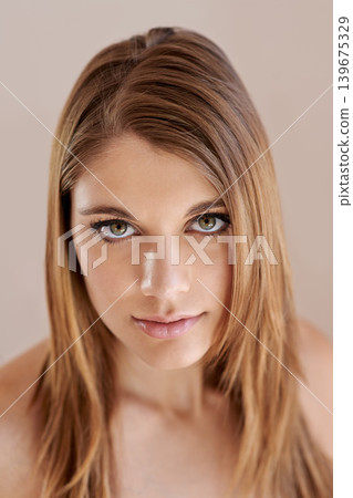 Beauty, makeup and portrait of young woman in studio with natural, glow and facial routine. Confidence, cosmetics and female person with self care, dermatology and face treatment by brown background. Beauty, makeup and portrait of young woman in studio with natural, glow and facial routine. Confidence, cosmetics and female person with self care, dermatology and face treatment by brown background. 139675329