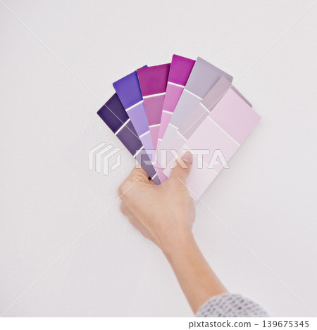 Hand, color swatches for interior design and paint choice, home renovation and person for development and plan. DIY project, painter decision and palette for creativity and decor on white background Hand, color swatches for interior design and paint choice, home renovation and person for development and plan. DIY project, painter decision and palette for creativity and decor on white background 139675345
