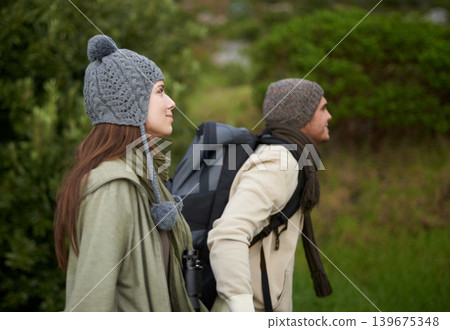 Couple, happy and hiking in forest or nature with travel, adventure or holiday for experience or fitness. Man, woman or trekking outdoor in woods for cardio, exercise or workout with view or backpack 139675348