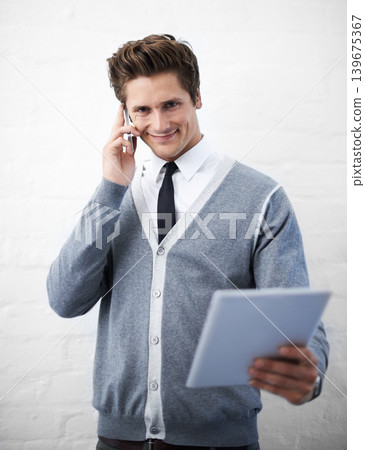 Business man, phone call and tablet in portrait, smile and contact with networking by wall background. Entrepreneur, employee or person with digital touchscreen, smartphone and happy for notification 139675367