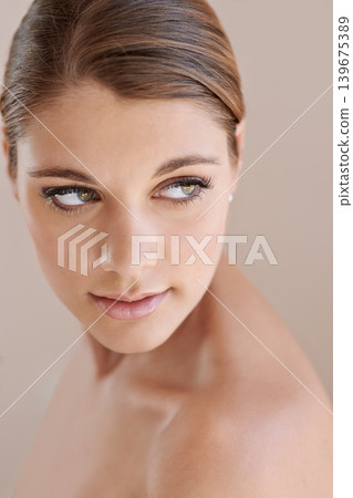 Face, beauty and skincare of woman in makeup at studio isolated on a brown background. Thinking, serious or young model in cosmetics, healthy glow of aesthetic or spa facial treatment for dermatology Face, beauty and skincare of woman in makeup at studio isolated on a brown background. Thinking, serious or young model in cosmetics, healthy glow of aesthetic or spa facial treatment for dermatology 139675389