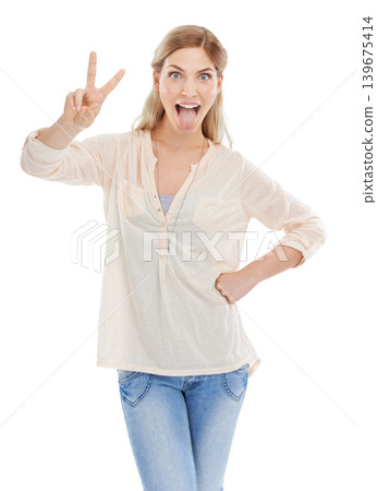 Portrait, tongue and peace sign with excited woman in studio isolated on white background for humor. Emoji, energy or comedy and confident young comic feeling silly or goofy with weird body language Portrait, tongue and peace sign with excited woman in studio isolated on white background for humor. Emoji, energy or comedy and confident young comic feeling silly or goofy with weird body language 139675414