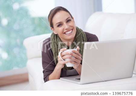 Happy woman, portrait or coffee with laptop on sofa for streaming movie, film or video at home. Face, smile or female person relax in living room with pc, tea or social media, subscription or service 139675776