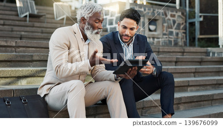Tablet, conversation and business men in the city in discussion for corporate legal case. Teamwork, collaboration and male attorneys with digital technology sitting and talking on stairs in town. Tablet, conversation and business men in the city in discussion for corporate legal case. Teamwork, collaboration and male attorneys with digital technology sitting and talking on stairs in town. 139676099