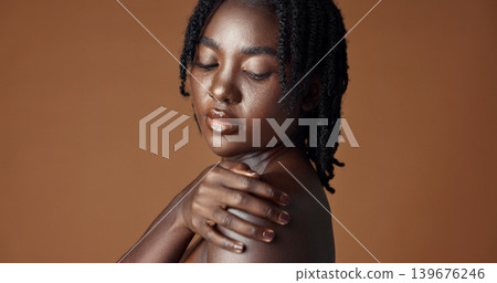 Face, beauty and skincare with happy black woman in studio isolated on brown background for wellness. Portrait, aesthetic and smile for foundation cosmetics or dermatology with a natural young person Face, beauty and skincare with happy black woman in studio isolated on brown background for wellness. Portrait, aesthetic and smile for foundation cosmetics or dermatology with a natural young person 139676246