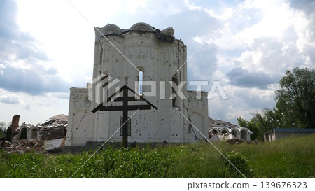 View to destroyed church at Kharkivska oblast. Ruined building after bomb attacks on ukrainian territory from russia army. Consequences of russian invasion of Ukraine. Slow motion 139676323