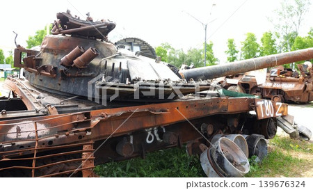 Rusty and burned-out armored vehicles on ukrainian territory. Exhibition of destroyed military equipment of the russian army. War between Ukraine and russia. Close up Slow motion Rusty and burned-out armored vehicles on ukrainian territory. Exhibition of destroyed military equipment of the russian army. War between Ukraine and russia. Close up Slow motion 139676324