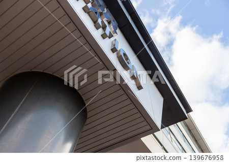 A modern station facade and urban architectural design that stands out against the blue sky. A modern station facade and urban architectural design that stands out against the blue sky. 139676958
