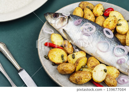 Salted herring with potatoes, onion and herbs Salted herring with potatoes, onion and herbs 139677084