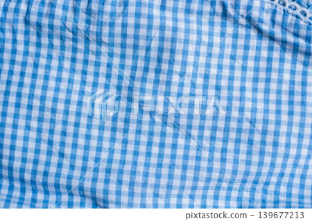 Blue and white gingham fabric pattern for textile design and fashion inspiration Blue and white gingham fabric pattern for textile design and fashion inspiration 139677213