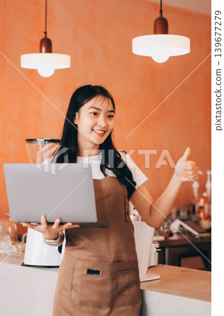 Young woman at barista school learning how to make espresso coffee. Young woman at barista school learning how to make espresso coffee. 139677279