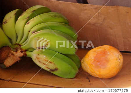 Sweet, ripe apple bananas and peaches sold at markets in Hawaii Sweet, ripe apple bananas and peaches sold at markets in Hawaii 139677376
