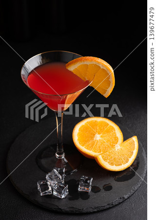 Martini Fiero Cocktail with Orange Fruit on Dark Background 139677479