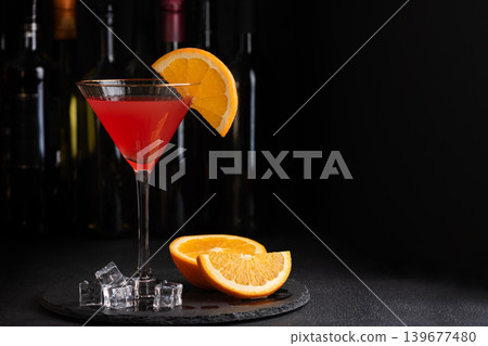Martini Fiero Cocktail with Orange Fruit on Dark Background Martini Fiero Cocktail with Orange Fruit on Dark Background 139677480