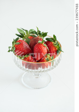 Summer Strawberries in Elegant Glass Bowls on White Table Summer Strawberries in Elegant Glass Bowls on White Table 139677488