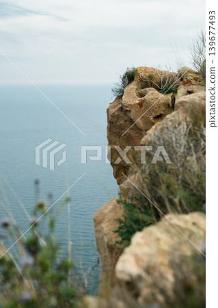 Cliffside serenity: breathtaking ocean view from rocky edge Cliffside serenity: breathtaking ocean view from rocky edge 139677493