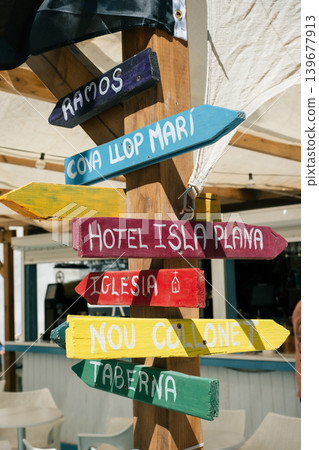 Colorful beach direction signs guide to restaurants, hotels, and attractions Colorful beach direction signs guide to restaurants, hotels, and attractions 139677913