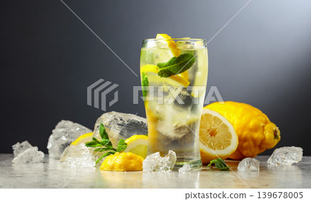 Carbonated refreshing drink with fresh lemon, ice and mint. Carbonated refreshing drink with fresh lemon, ice and mint. 139678005
