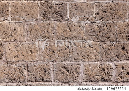 Old Brick House Wall in Italy, Rustic Mediterranean Background Texture Old Brick House Wall in Italy, Rustic Mediterranean Background Texture 139678524