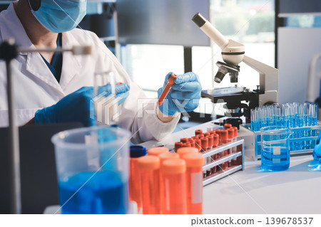 Lab technician experimenting in lab Lab technician experimenting in lab 139678537