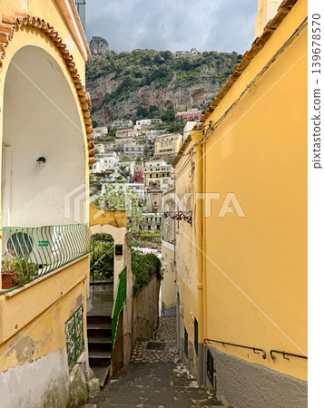 Narrow street view with sea and beach in Positano Italy Narrow street view with sea and beach in Positano Italy 139678570