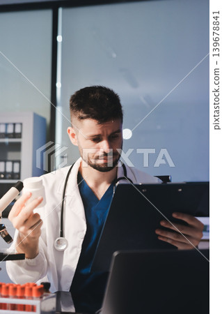 Attractive student of chemistry working in laboratory 139678841