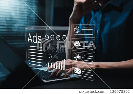 Digital marketing advertising concept. Person using laptop with virtual dashboard icons showing social media ads data, online content platform, campaign performance, target analytics, ad metrics, 139678892