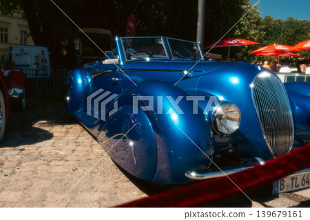 Berlin, Germany - May 2, 2026: Blue Vintage Roadster at Classic Car Show Berlin, Germany - May 2, 2026: Blue Vintage Roadster at Classic Car Show 139679161