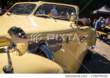 Berlin, Germany - May 2, 2026: Yellow Vintage Convertible Detail Berlin, Germany - May 2, 2026: Yellow Vintage Convertible Detail 139679200