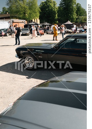 Berlin, Germany - May 2, 2026: Black Ford Mustang at Classic Car Event Berlin, Germany - May 2, 2026: Black Ford Mustang at Classic Car Event 139679287
