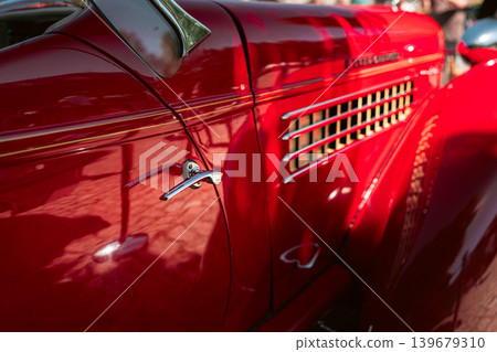 Berlin, Germany - May 2, 2026: Red Classic Car Detail at Show Berlin, Germany - May 2, 2026: Red Classic Car Detail at Show 139679310