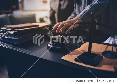 Lawyer explained to the client about the law that must be brought against the court case. Lawyer explained to the client about the law that must be brought against the court case. 139679494
