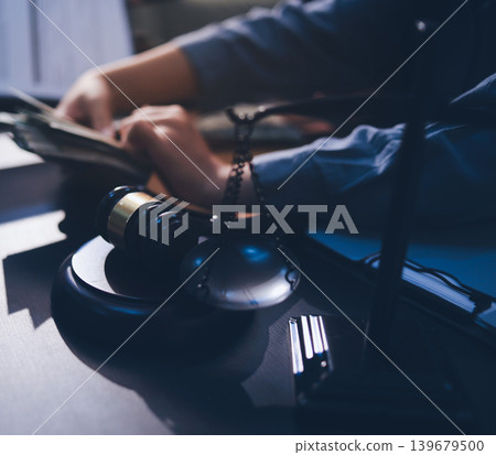Lawyer explained to the client about the law that must be brought against the court case. Lawyer explained to the client about the law that must be brought against the court case. 139679500