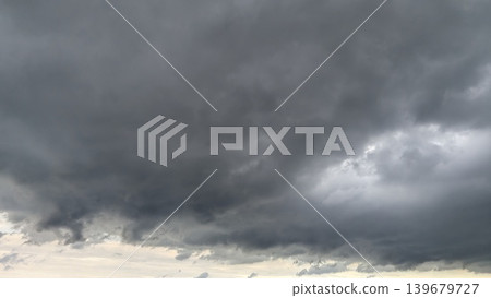 Dark storm clouds fill the entire frame. Massive gray formations create a heavy, atmospheric mood. Ominous weather patterns dominate the sky. Swirling overcast layers suggest approaching rain, Dark storm clouds fill the entire frame. Massive gray formations create a heavy, atmospheric mood. Ominous weather patterns dominate the sky. Swirling overcast layers suggest approaching rain, 139679727