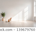 A quiet, minimalist space where natural light and greenery shine, and a cat 139679760