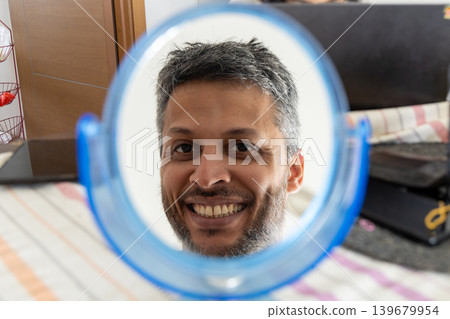 Cheerful Man in Round Mirror 139679954