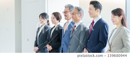 Profiles of business people lined up in a row Profiles of business people lined up in a row 139680944