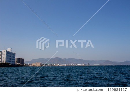 Blue sky, calm sea, and coastal townscape Blue sky, calm sea, and coastal townscape 139681117