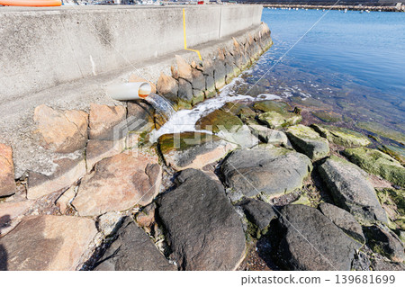 Seawater flowing out of the drainage pipes of the embankment Seawater flowing out of the drainage pipes of the embankment 139681699
