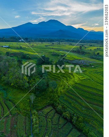 The natural beauty of the Indonesian mountains with beautiful tropical forests at sunrise The natural beauty of the Indonesian mountains with beautiful tropical forests at sunrise 139682083