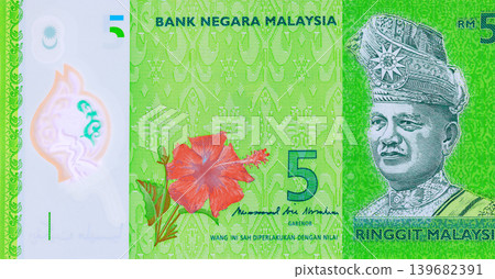 Money in Malaysia is represented by five ringgit banknotes of Malaysian paper currency Money in Malaysia is represented by five ringgit banknotes of Malaysian paper currency 139682391