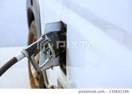Car getting fuel at gas station automotive service petrol station 139682396