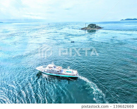 A sightseeing boat sailing on the sea A sightseeing boat sailing on the sea 139682669