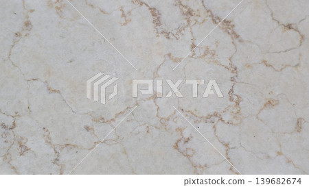 A white marble surface is covered in an intricate network of thin, brown and gold lines that resemble a cracked or veined pattern. The texture and detail fill the entire frame. A white marble surface is covered in an intricate network of thin, brown and gold lines that resemble a cracked or veined pattern. The texture and detail fill the entire frame. 139682674