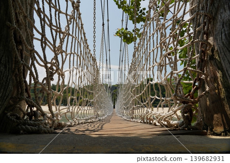 Scenic rope bridge perspective in Sentosa Singapore Scenic rope bridge perspective in Sentosa Singapore 139682931