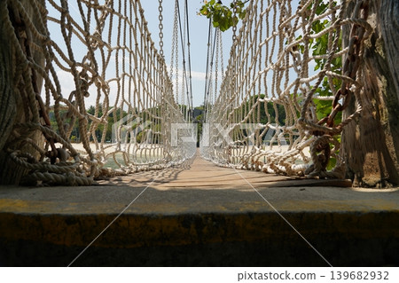 Suspension Bridge Leading to a Tropical Beach Paradise 139682932